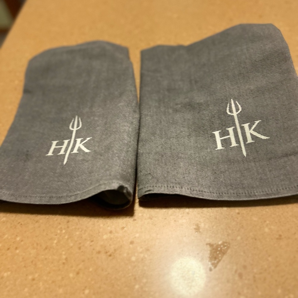 Two brand new authentic Hells Kitchen linen gray napkins